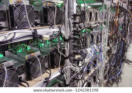 Cryptocurrency mining farm. Miner on the rack with cables . Рealistic miner asic pictures