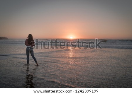 Traveling women observing the beautiful sunset over the Pacific Ocean in Redondo Beach.