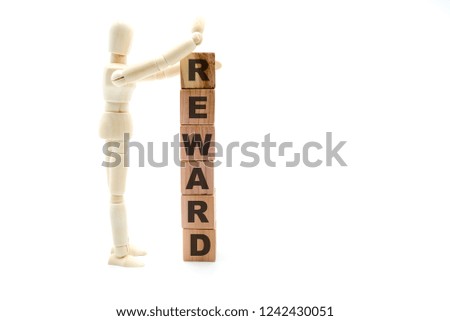Wooden figure as businessman building Reward as tower of wood cubes, isolated on white background, minimalist concept