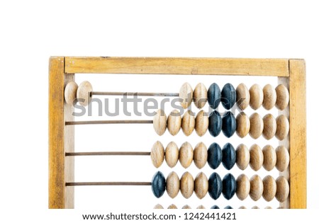 Old wooden abacus on bright background. 