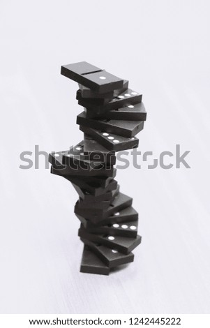 close up. tower built of Domino chips on white background