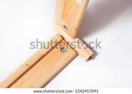 Woman hands assamble wooden furniture