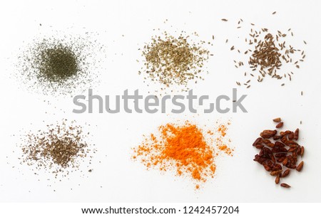 VARIED SPICES ON A WHITE BACKGROUND Royalty-Free Stock Photo #1242457204