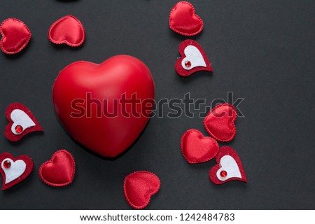 Close up red hearts on black background. Valentine's day concept - love symbols.