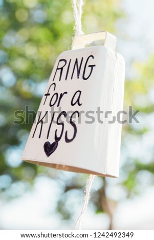 western themed wedding decoration, white cowbell that says ring for a kiss, shabby chic, country chic, diy wedding decor, country themed wedding