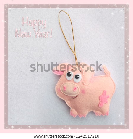 New year. Soft toy made of felt. The cute pig. Christmas tree decoration. Symbol of year. 2019. Children's card.