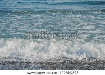 blue water background with waves. Sea low angle view, wave. Close up Nature background.