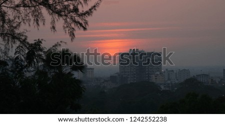 Sunset behind an apartment block in Yangon, Myanmar.