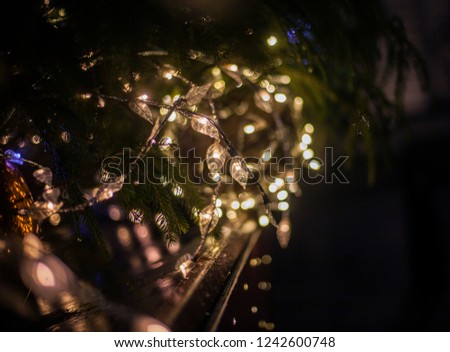 Close-up shot of beautiful  illumination and decoration on the Christmas tree