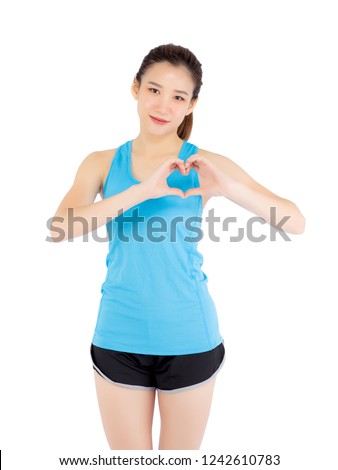 Beautiful portrait young asian woman wear sport clothing hand gesture heart shape with confident isolated on white background, girl asia have wellness, exercise for fit with health concept.