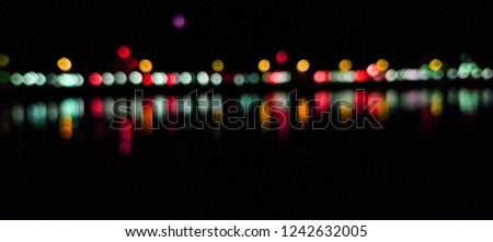 Light night at city bokeh blur abstract background. Blue black focus flare. Royalty-Free Stock Photo #1242632005