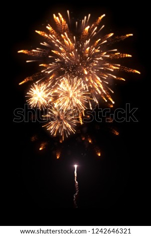 High-quality image of beautiful golden fireworks with trail isolated on the black background for overlay design of celebration new year or festivals