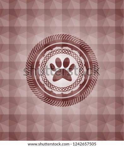 paw icon inside red seamless emblem or badge with abstract geometric pattern background.