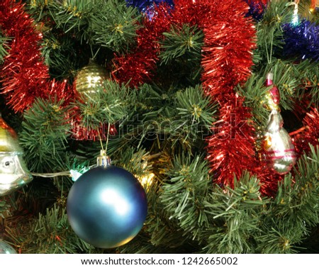 many of toys on green christmas fir 