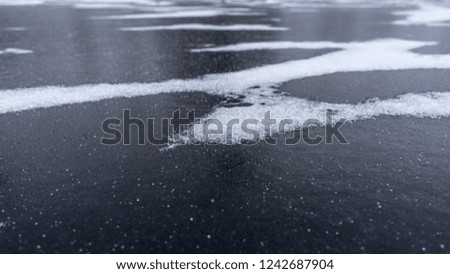 Abstract texture of river ice surface. Winter background.