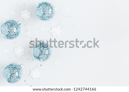Christmas composition. Frame made of balls and snowflakes on pastel gray background. Christmas, winter, new year concept. Flat lay, top view, copy space