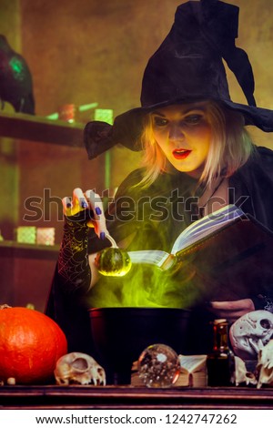 Image of witch blonde in black hat with book brewing potion in pot with green steam