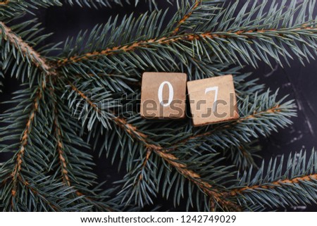Advent calendar. Countdown to Christmas. Wooden numbers. Number seven. Christmas background. Winter background. Royalty-Free Stock Photo #1242749029