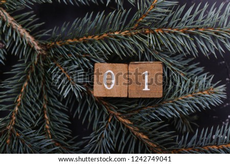 Advent calendar. Countdown to Christmas. Wooden numbers. Number one. Christmas background. Winter background.  Royalty-Free Stock Photo #1242749041