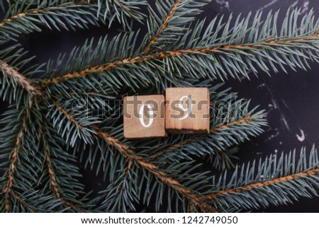Advent calendar. Countdown to Christmas. Wooden numbers. Number nine. Christmas background. Winter background.