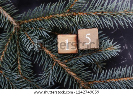 Advent calendar. Countdown to Christmas. Wooden numbers. Number fifteen. Christmas background. Winter background. 