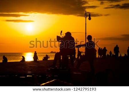 Behind the scene. Film crew team filming movie scene on outdoor location at sunset. Trieste Royalty-Free Stock Photo #1242795193