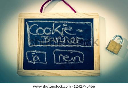 Blackboard with inscription cookie banner and padlock