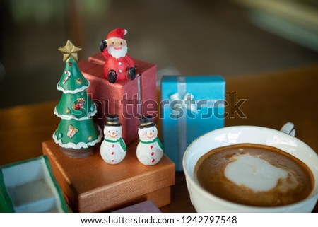 Holiday Background with Christmas tree,set gift ,santa,snowman,and Coffee cup 