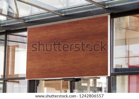 Outdoor horizontal sign on shop front window mockup