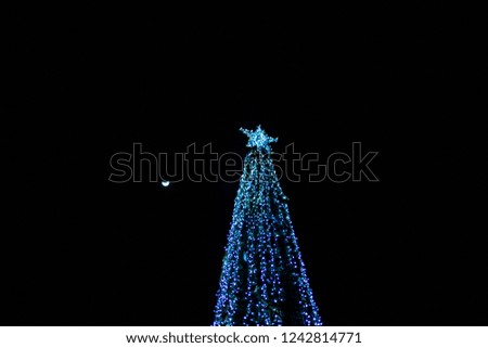 Closeup of Christmas tree with bokeh light background.