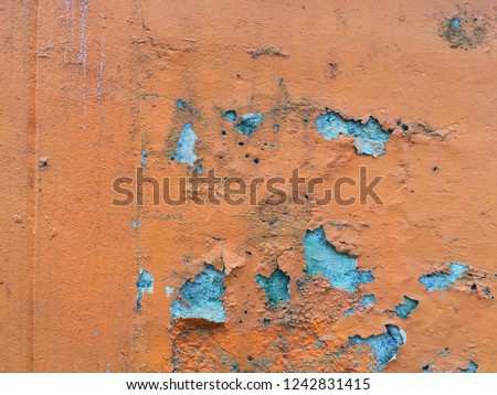 Cracked and decay of old orange concrete, wall background, 