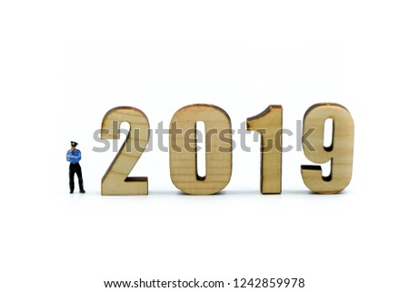 Miniature people : Police with wooden number of 2019,Happy New Year 2019 concept.