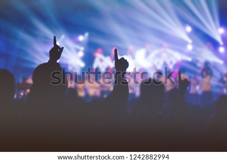 Selective focus of Christian worship with raised hand at church,music concert.