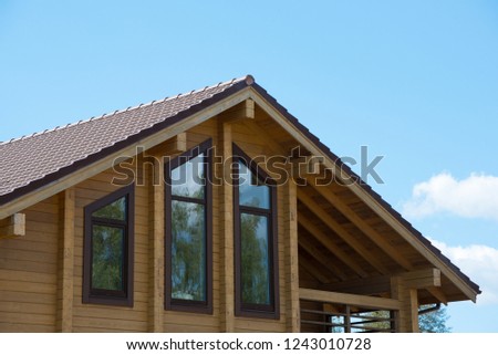 Beautiful wooden house in countryside. Modern style. Natural photo.