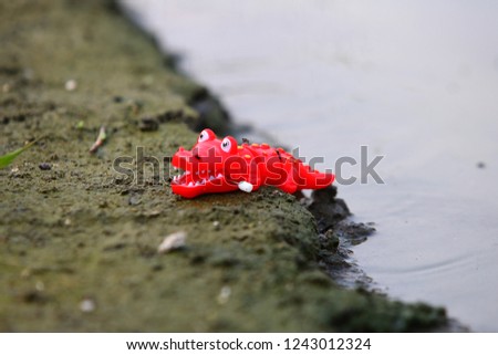  crocodile toy with river side