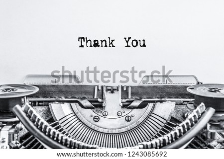 Thank you. The text is typed on a vintage typewriter on a white background. Close-up. 