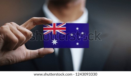 Businessman Holding Card of Australia Flag 