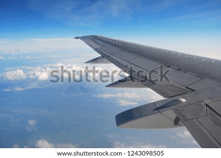 Airplane wing above the clouds