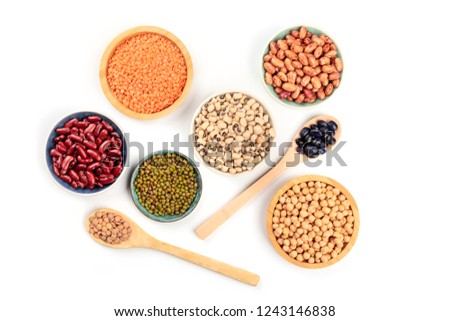 Various types of pulses, shot from the top on a white background. Red kidney, pinto, and black beans, lentils, chickpeas, soybeans, and black-eyed peas Royalty-Free Stock Photo #1243146838