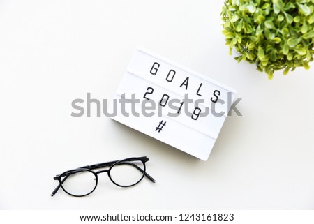 GOALS 2019 text on lightbox composition on white table background copy space,Business Concept.