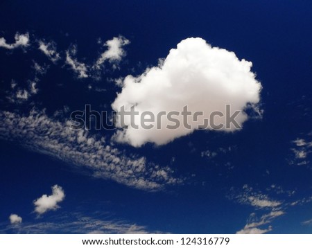 white cumulus in blue morning sky