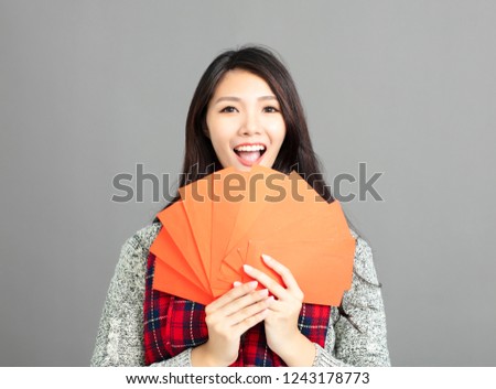 asian woman showing red envelopes for chinese new year