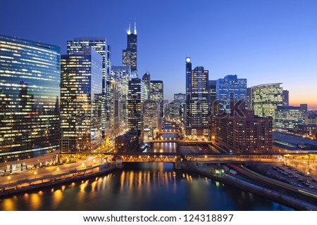 City of Chicago. Image of Chicago downtown and Chicago River with bridges during sunset. Royalty-Free Stock Photo #124318897