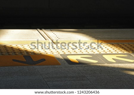 Closeup of entrance and exit arrow at BTS, sky train, one of transportation in Bangkok, Thailand