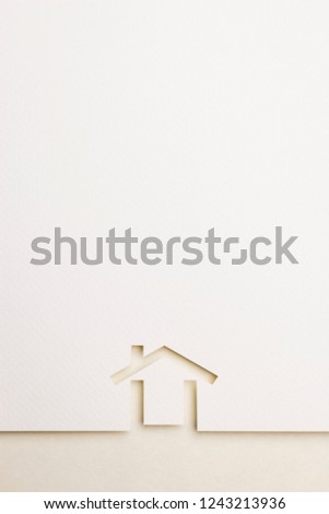 white paper cutout in minimal house shape with border background by eyecare paper, for home and insurance conceptual.