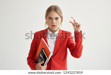 woman in a red jacket with bitcoin cryptocurrency                  