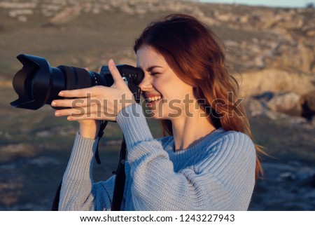 woman with a camera in nature                