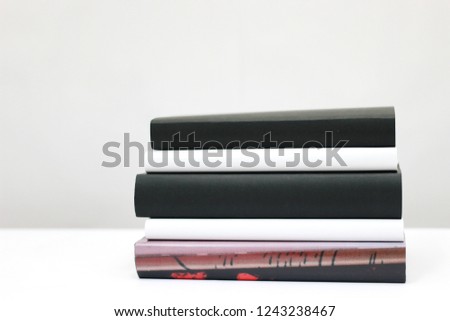 Stack og books on white
