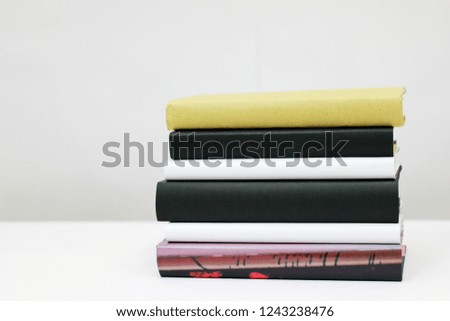 Stack og books on white