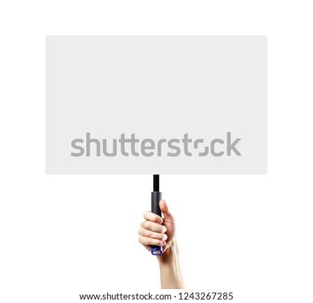 Hand holding a white blank plate with a handle. Close up. Isolated on white background